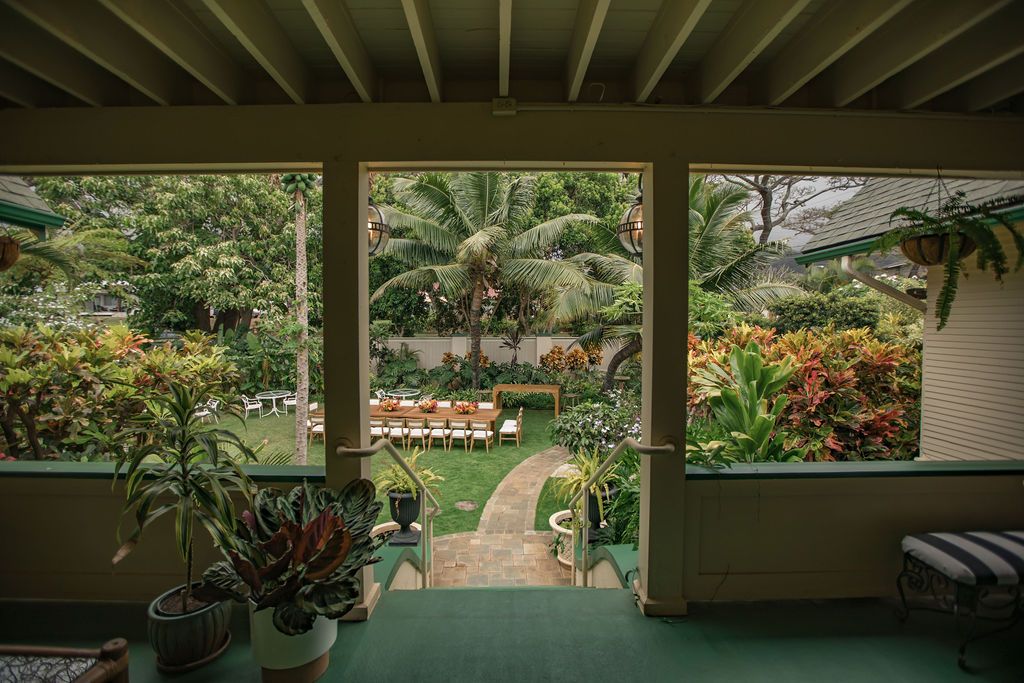 Teak dining table with tropical centerpiece
